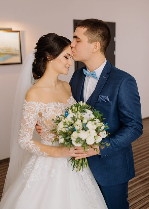 The first meeting of the bride and groom. First look of wedding couple in the morning.